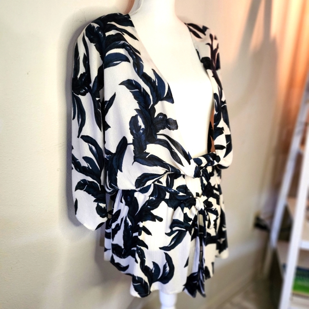 Romper, off white & dark blue, soft gauzey material. 100% Rayon. Size Medium.